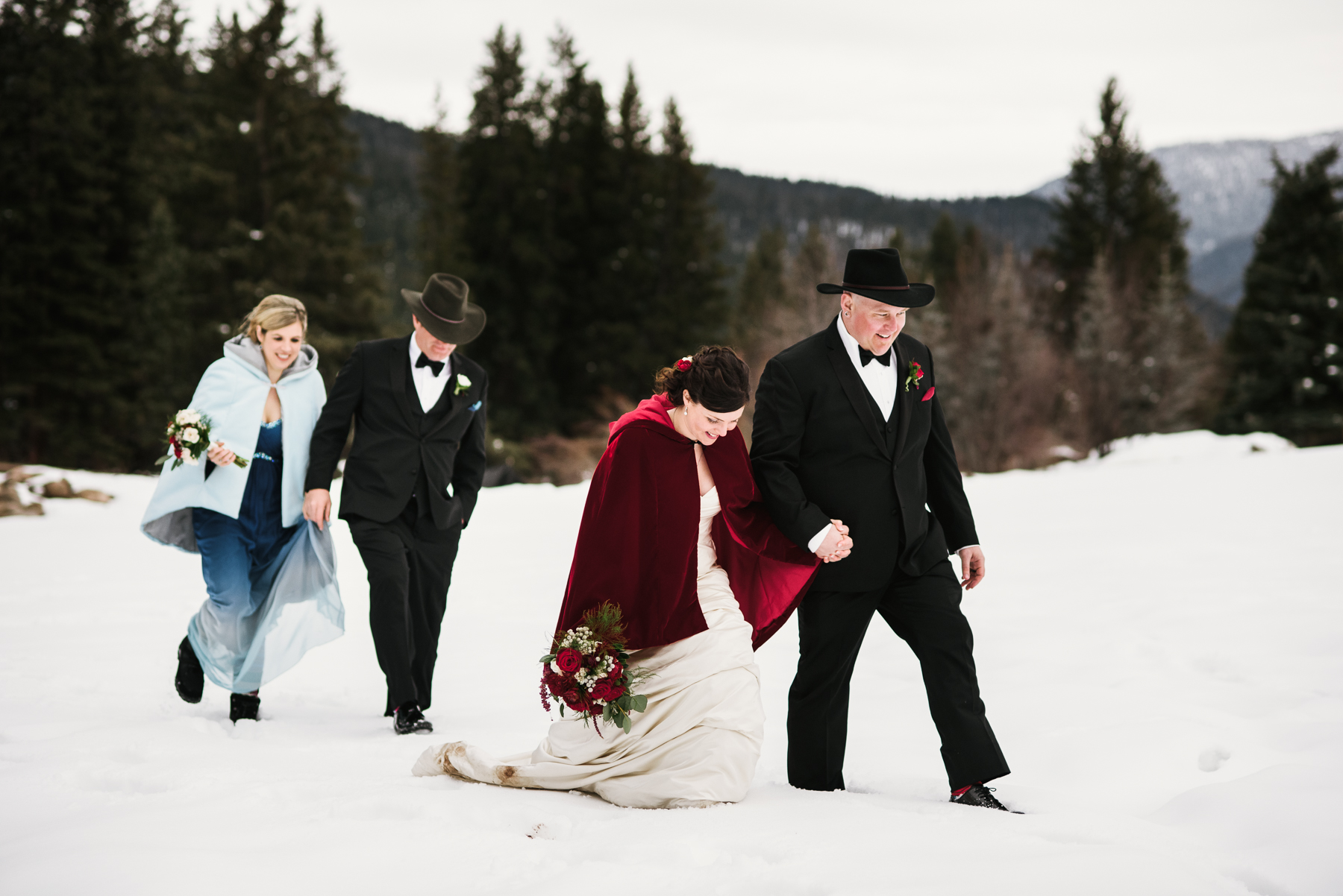 rainbow ranch bridal party walking in snow