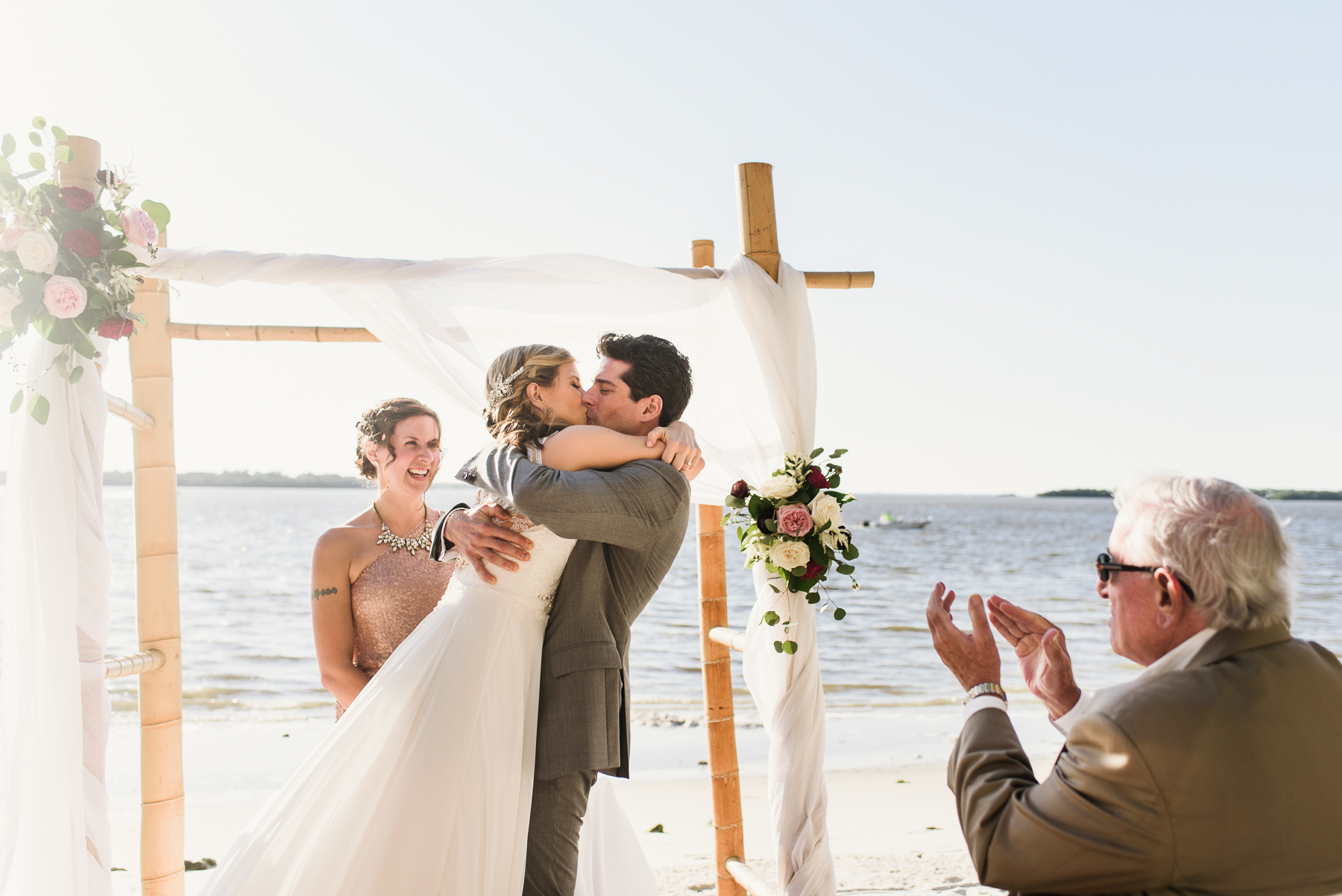 florida beach wedding ceremony first kiss