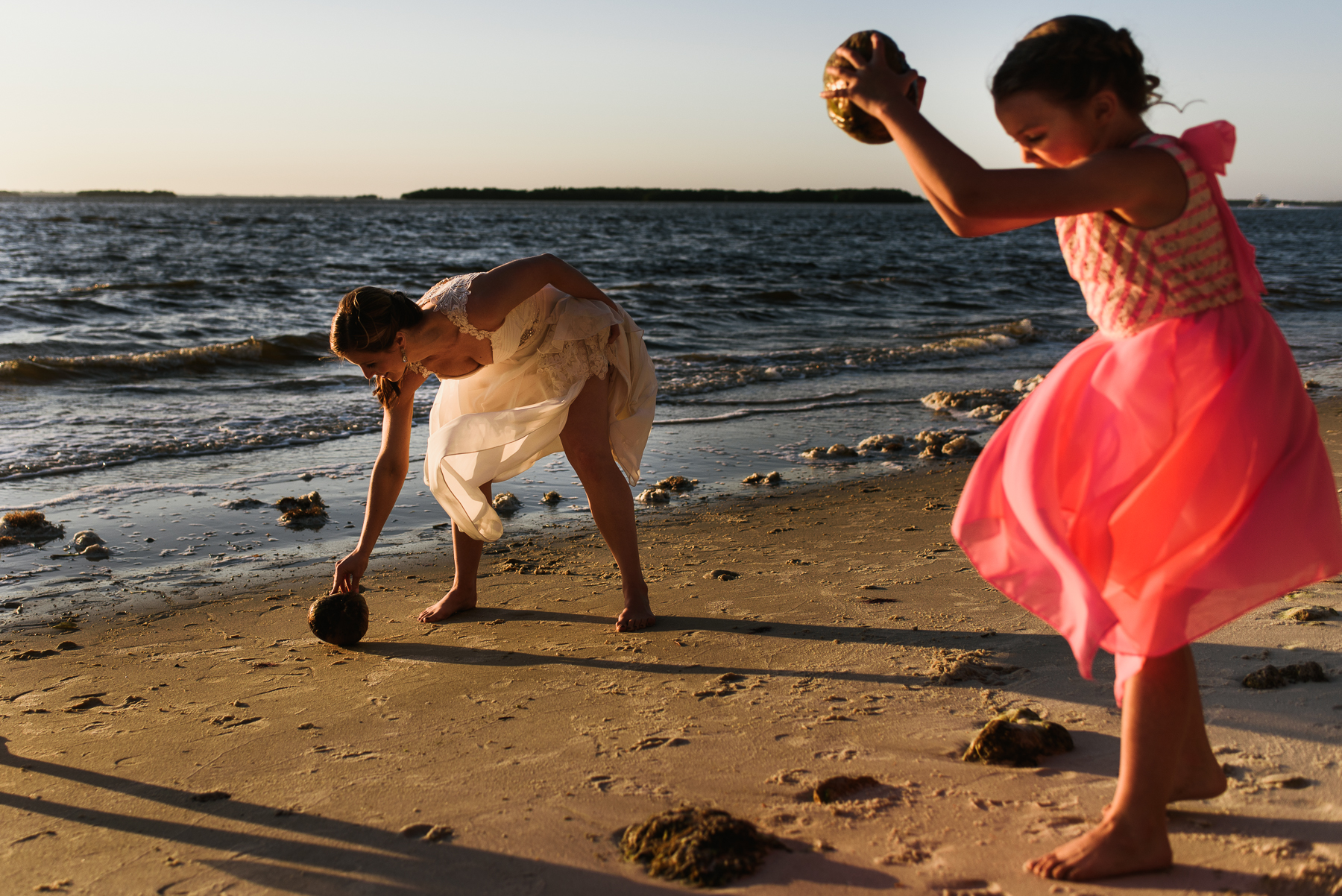 flower girl and bride cracks coconut 