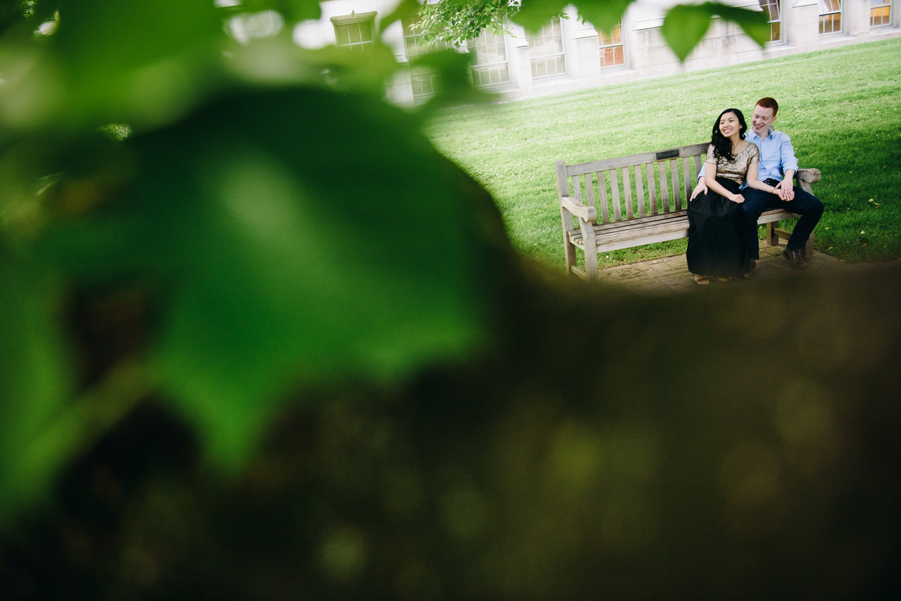 uw campus couple on bench in quad