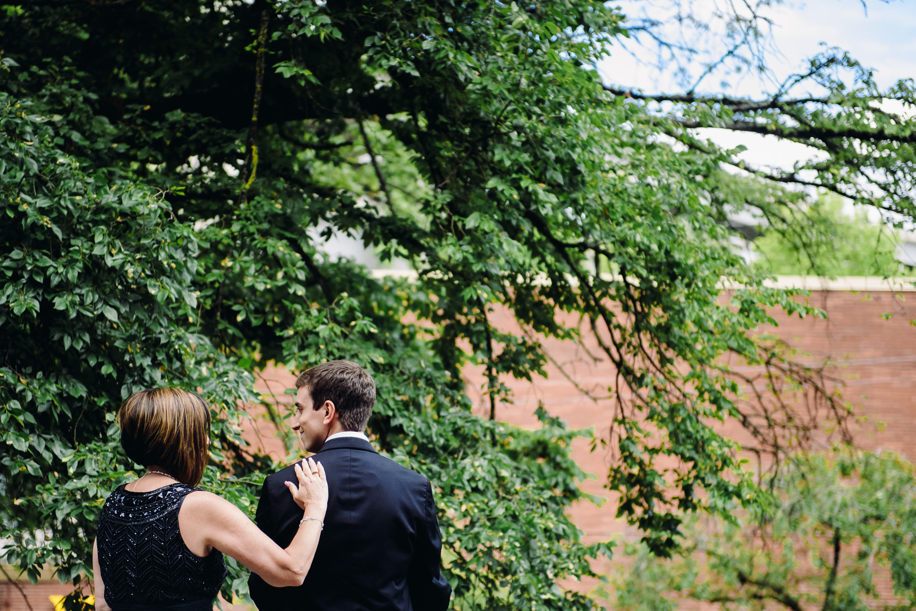 mom and son moment before wedding