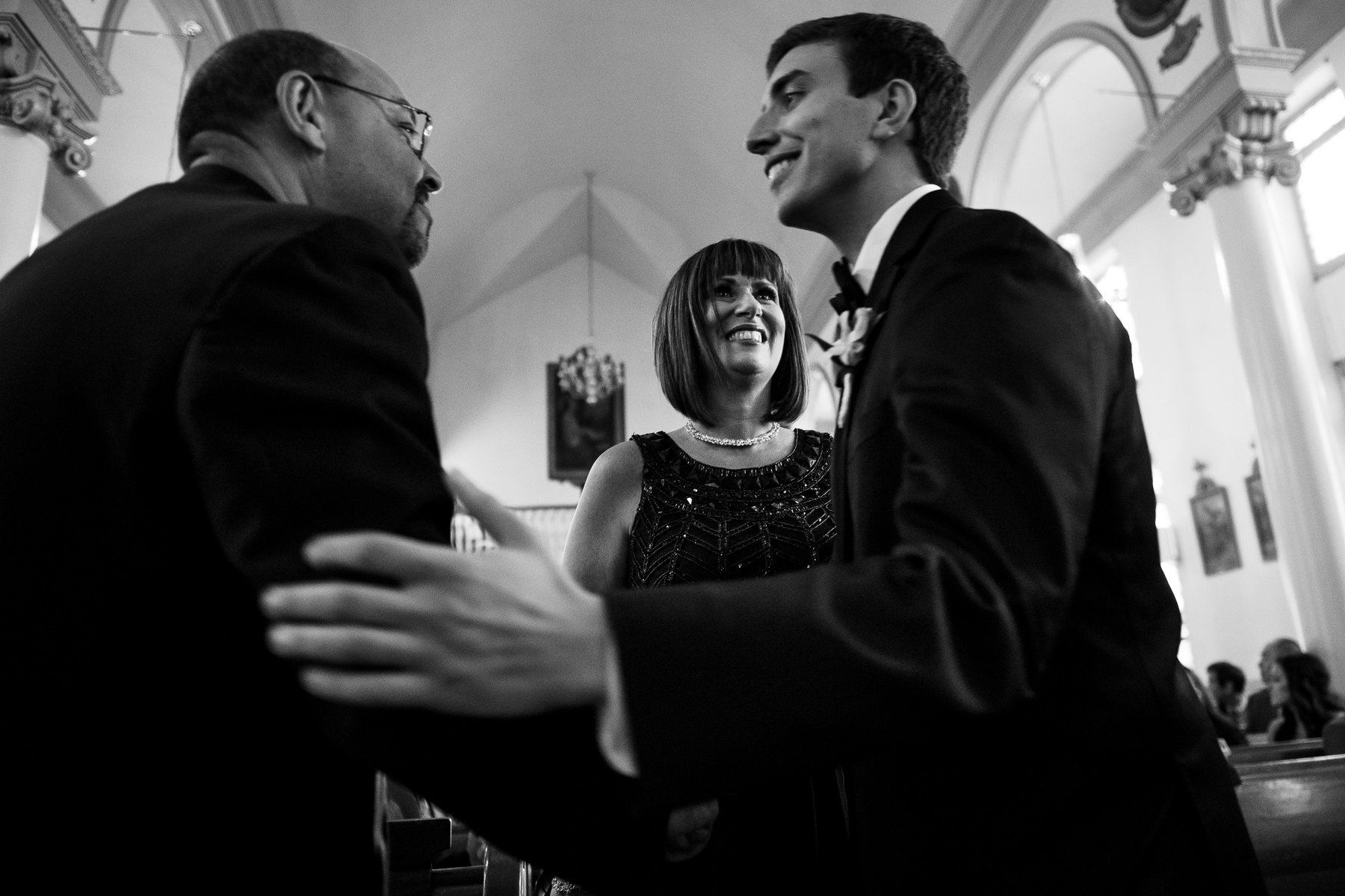 groom and parents during ceremony