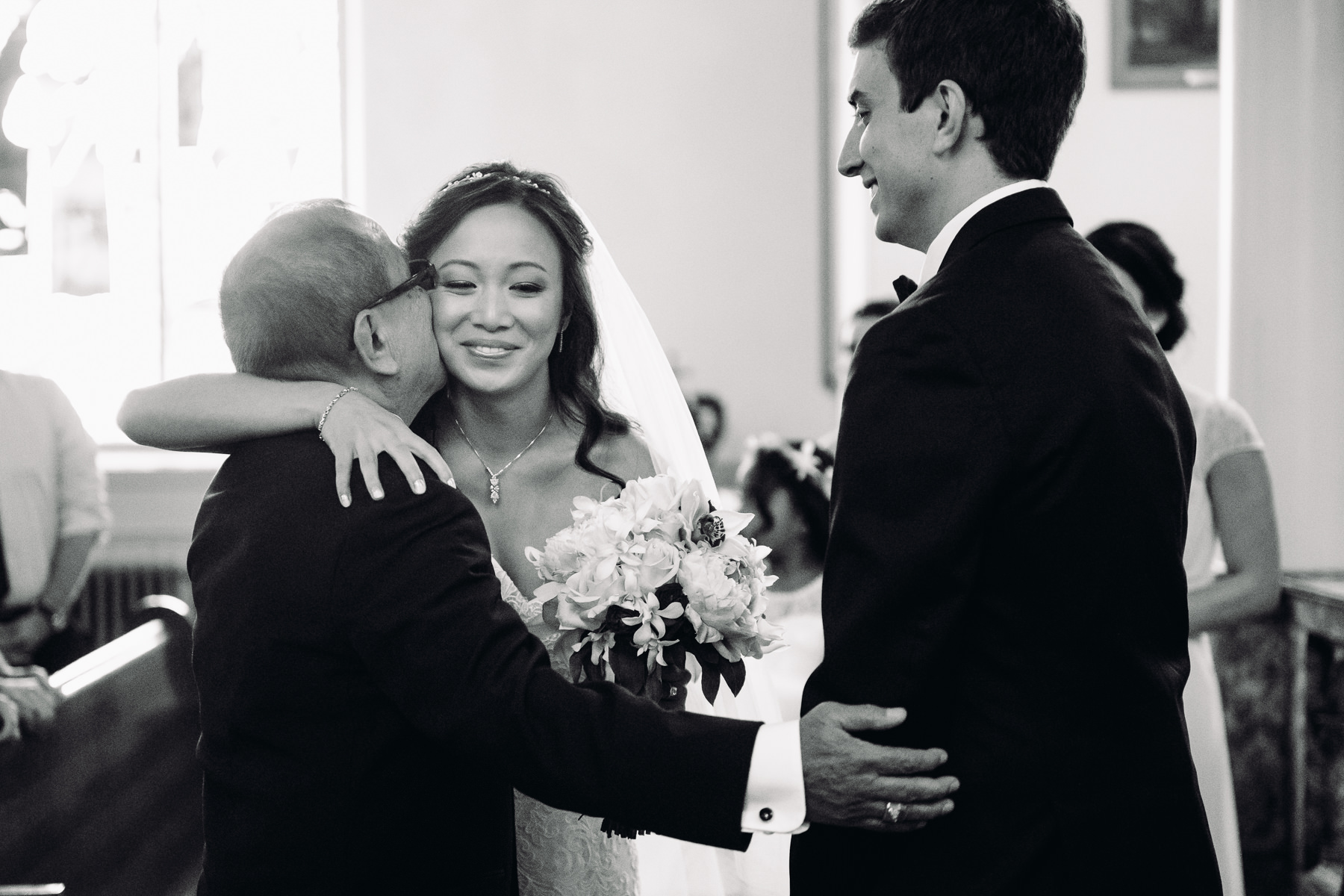 bride and father giving away