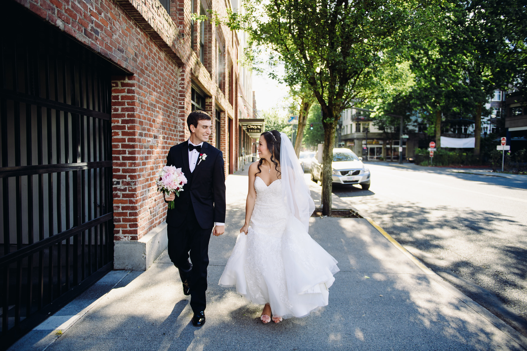 bride and groom walking downtown portland