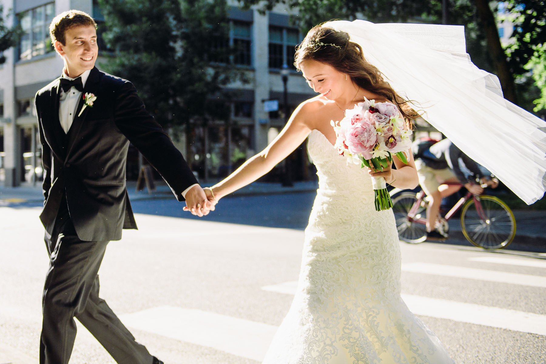 bride and groom walking downtown portland