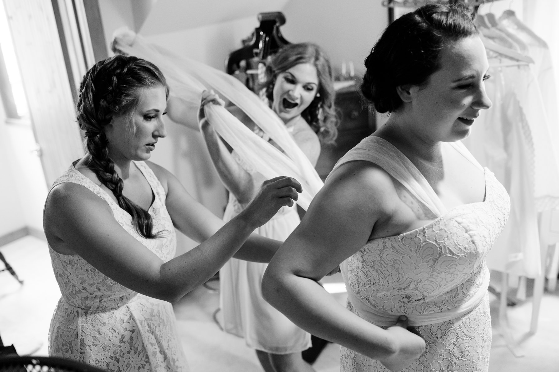 putting on wedding dress moment