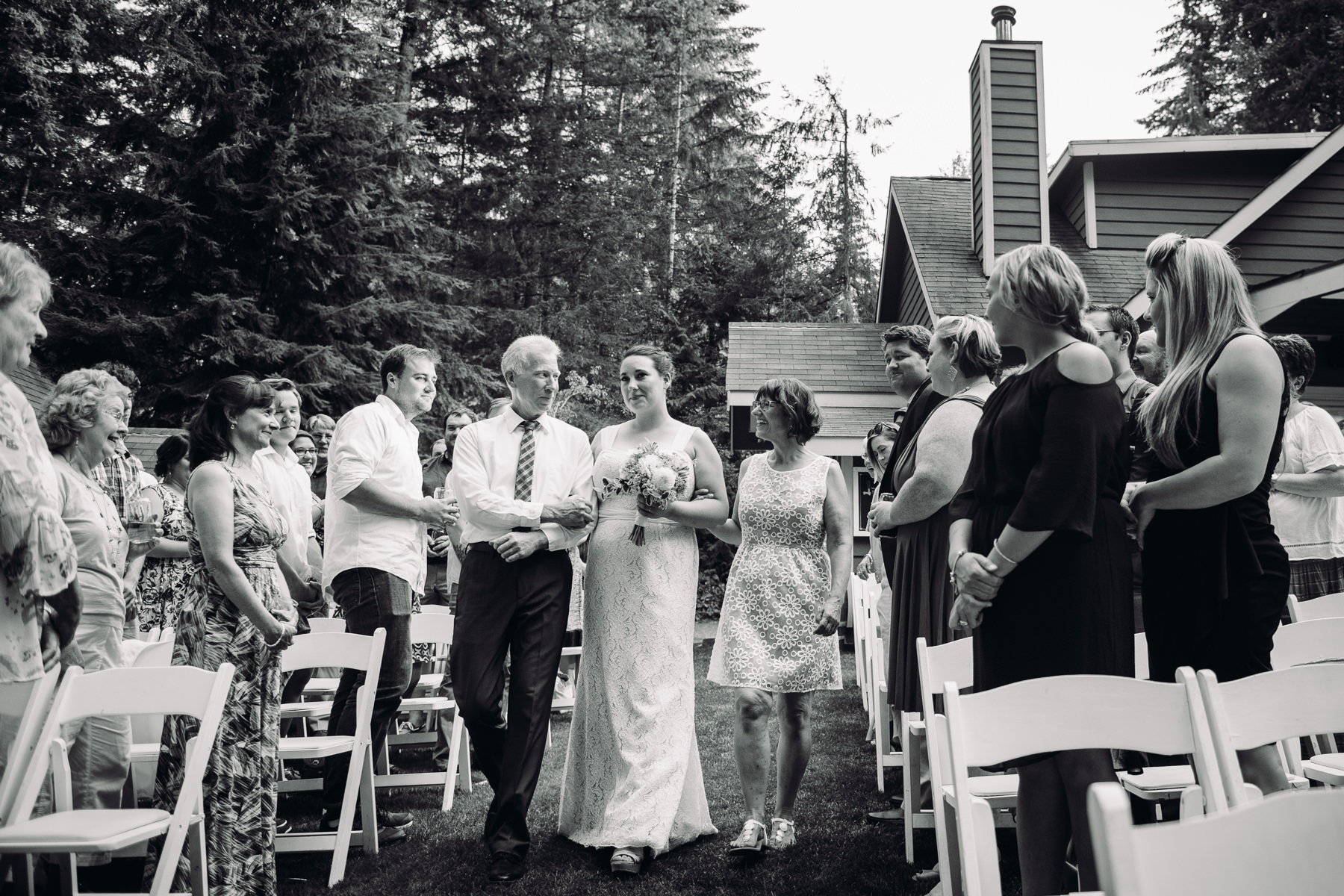 parents walking bride down the aisle 