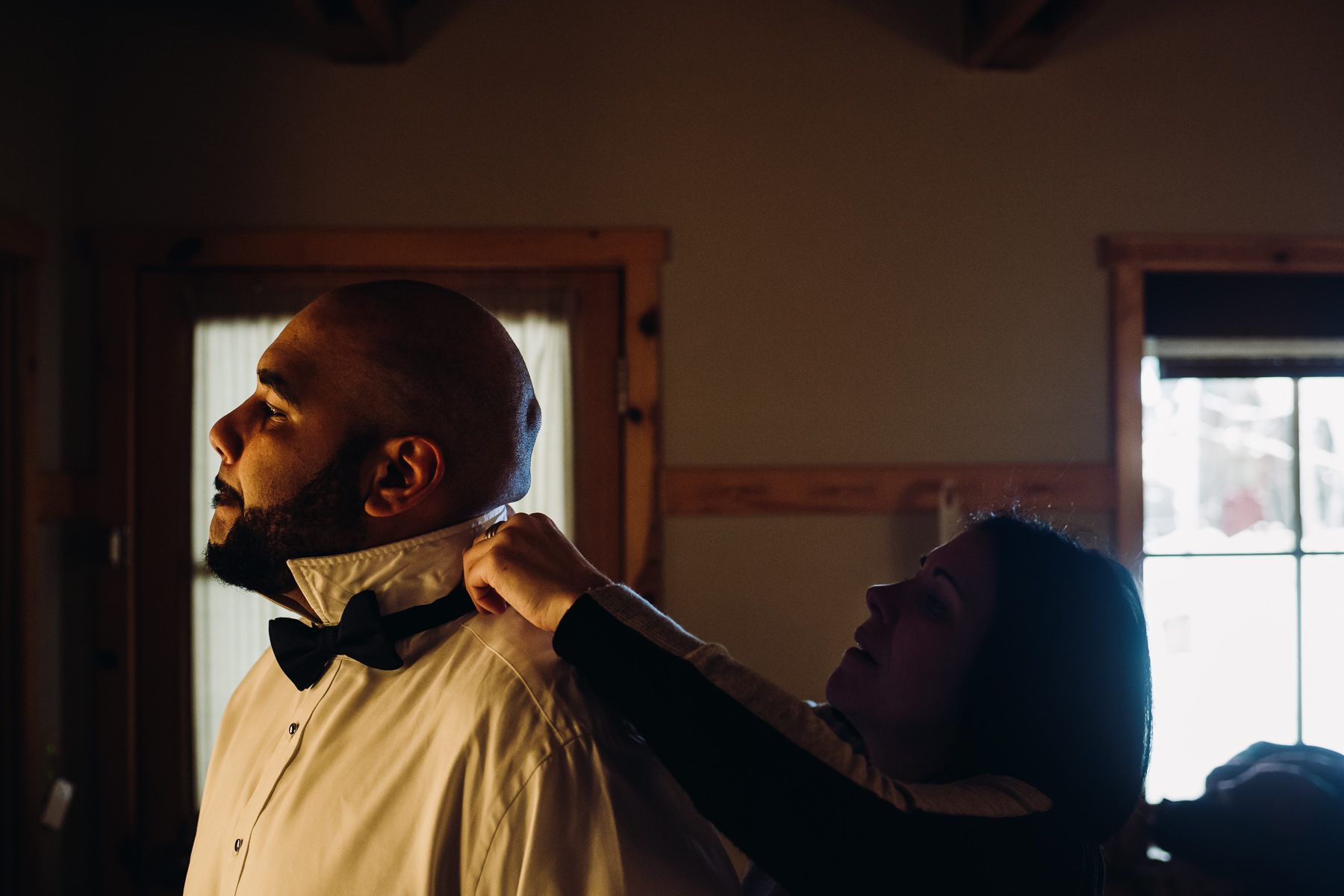 groom getting ready at sleeping lady resort