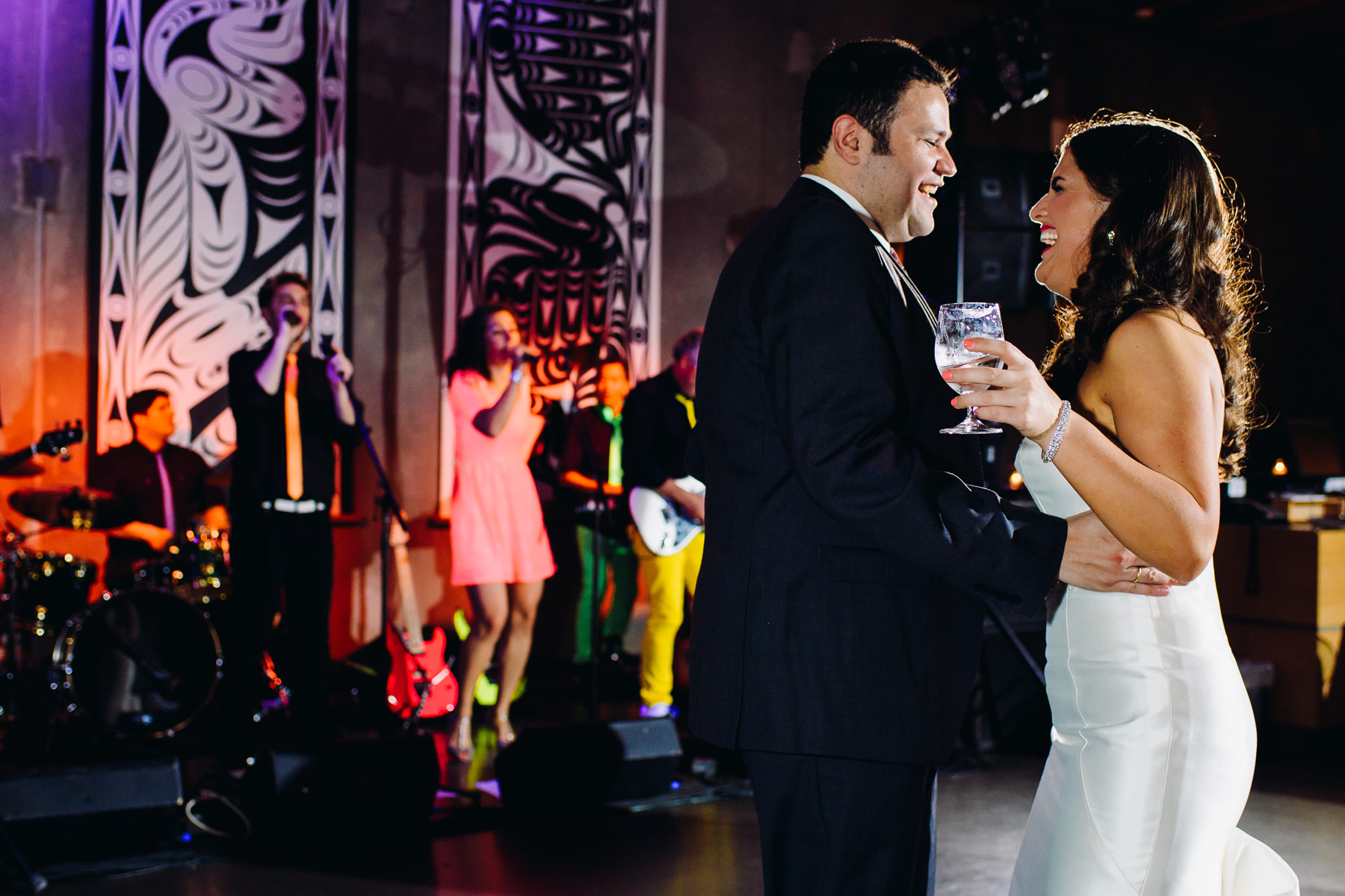 bride and groom dancing to live band