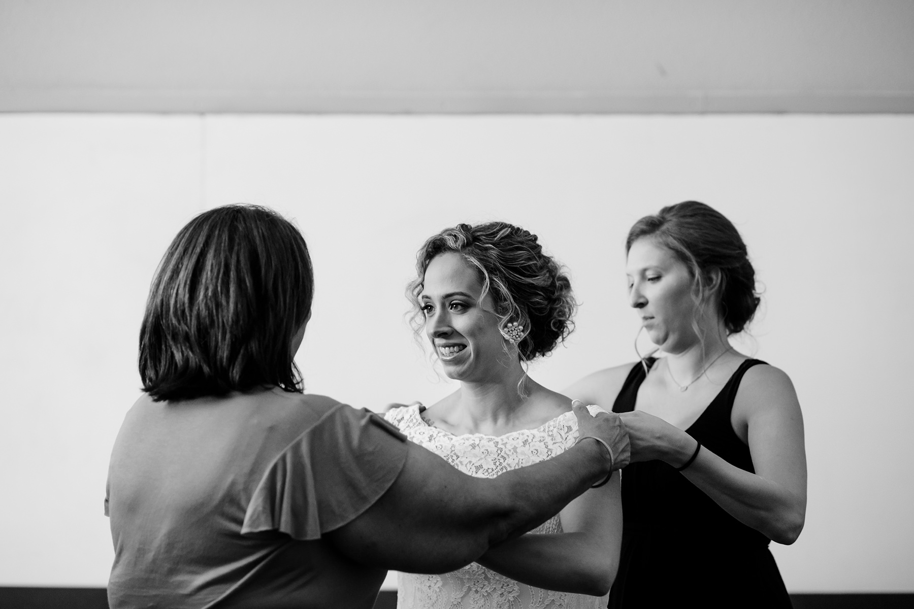 tierra retreat center bride getting into dress