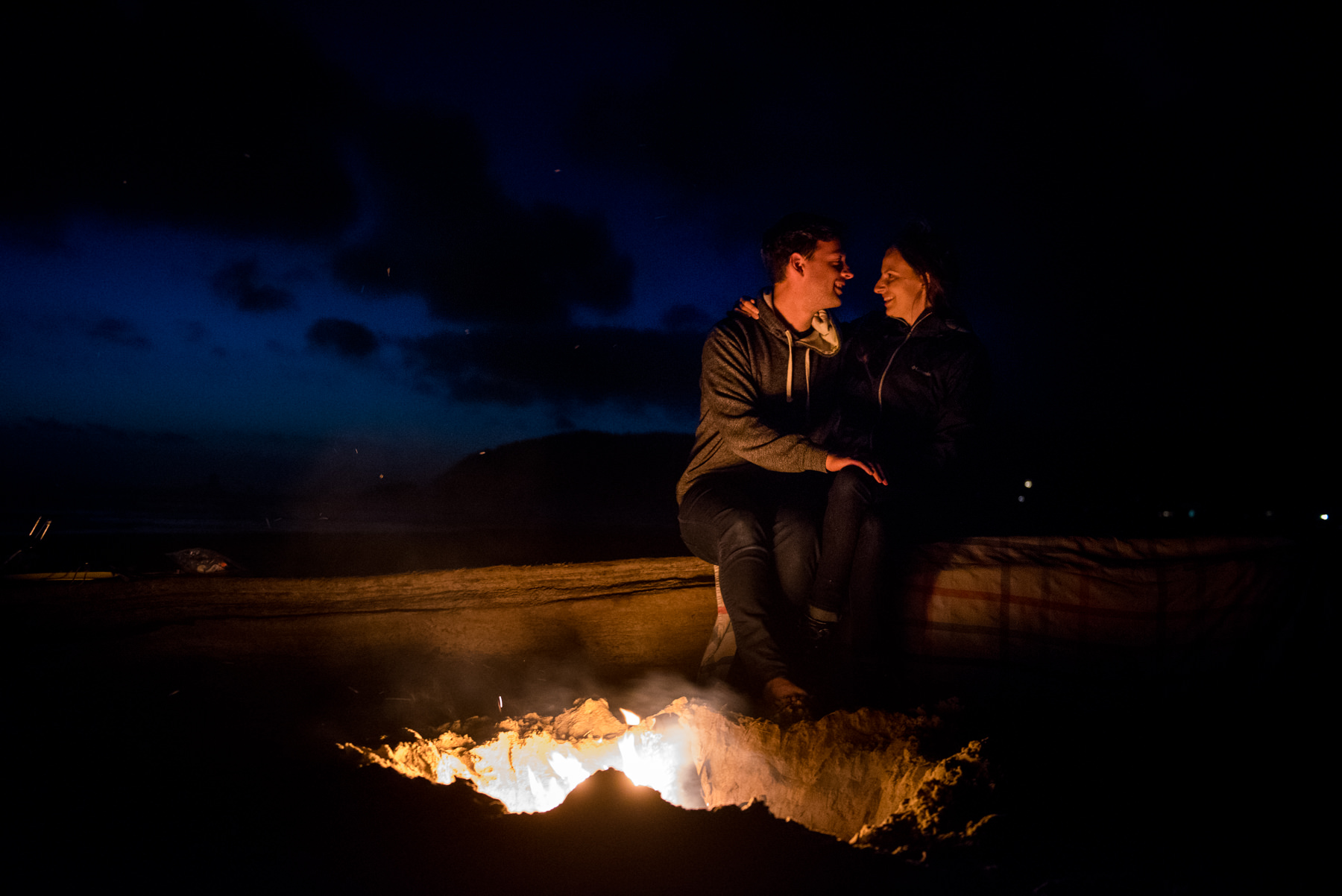 beach campfire engagement session 