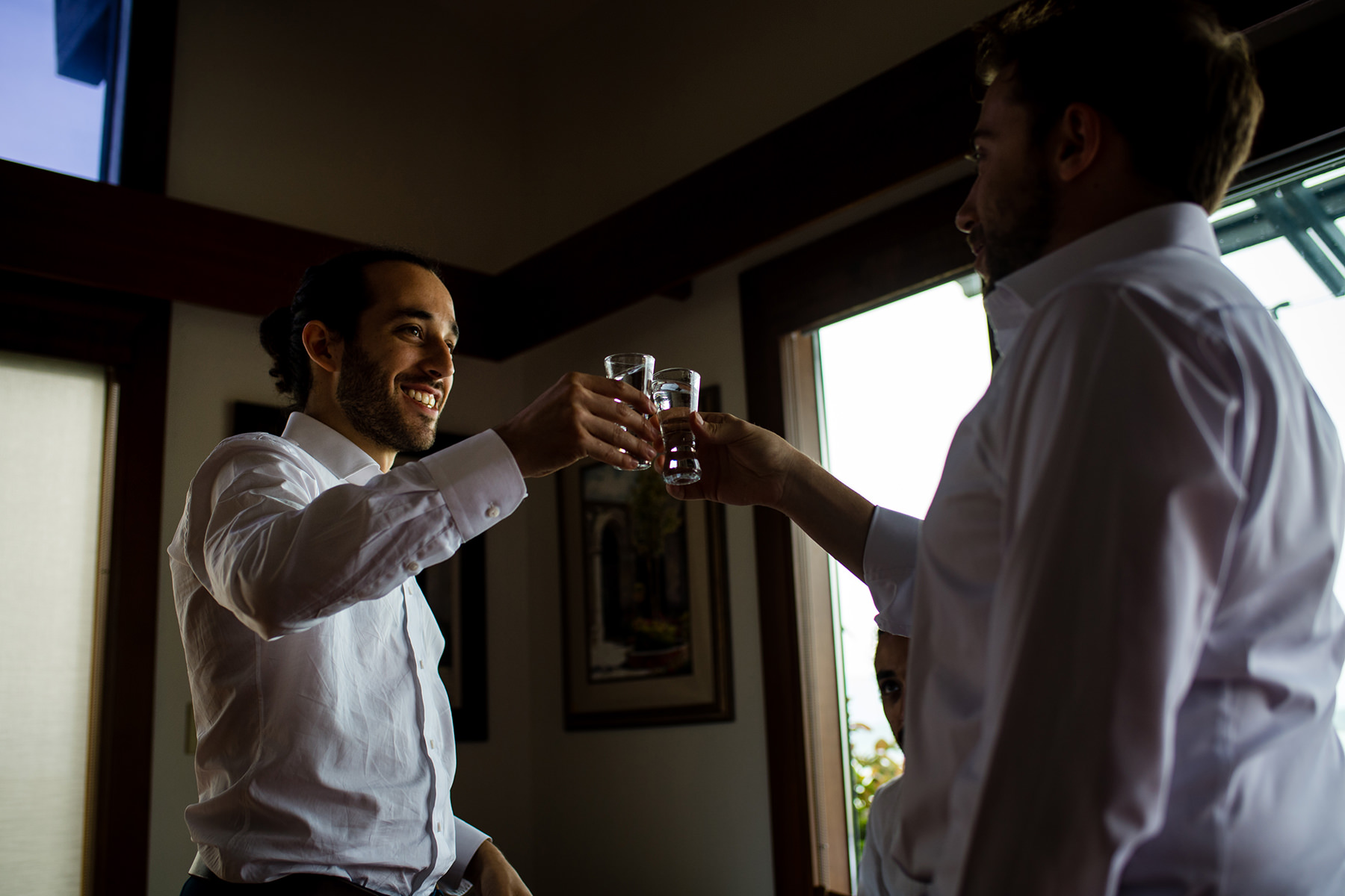 groom and friend taking a shot