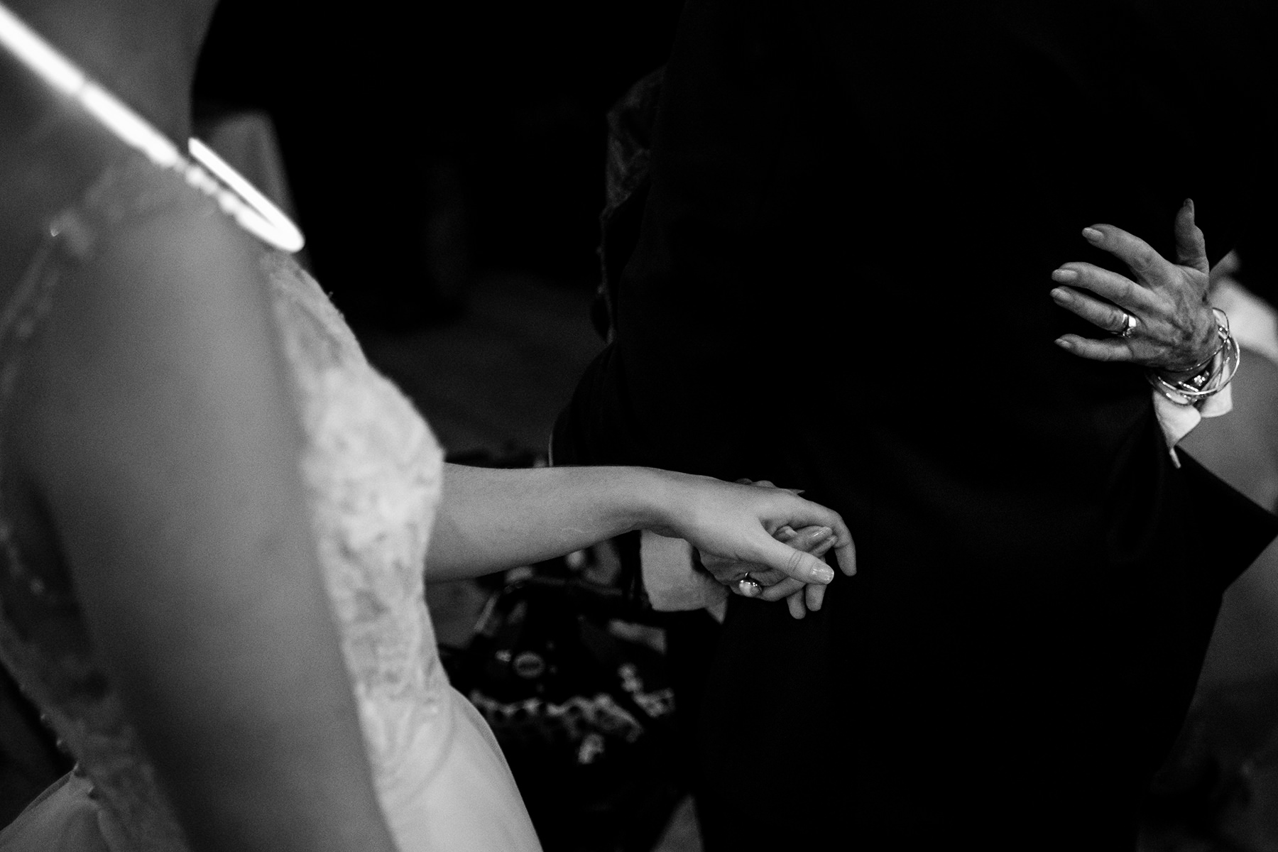 bride holding hands with grandmother in law