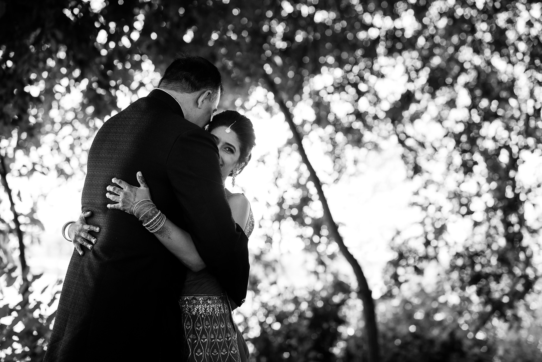 bride and groom hugging