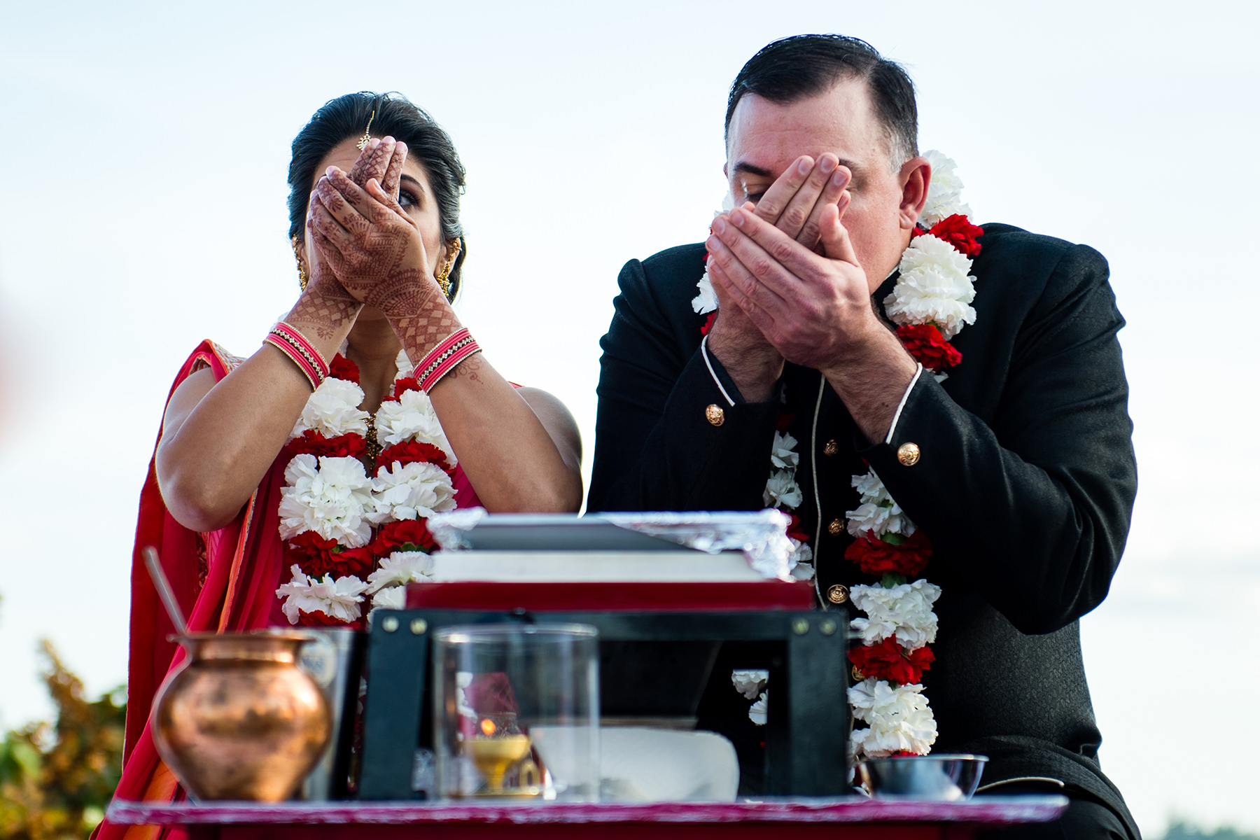 bride and groom drink water during wedding