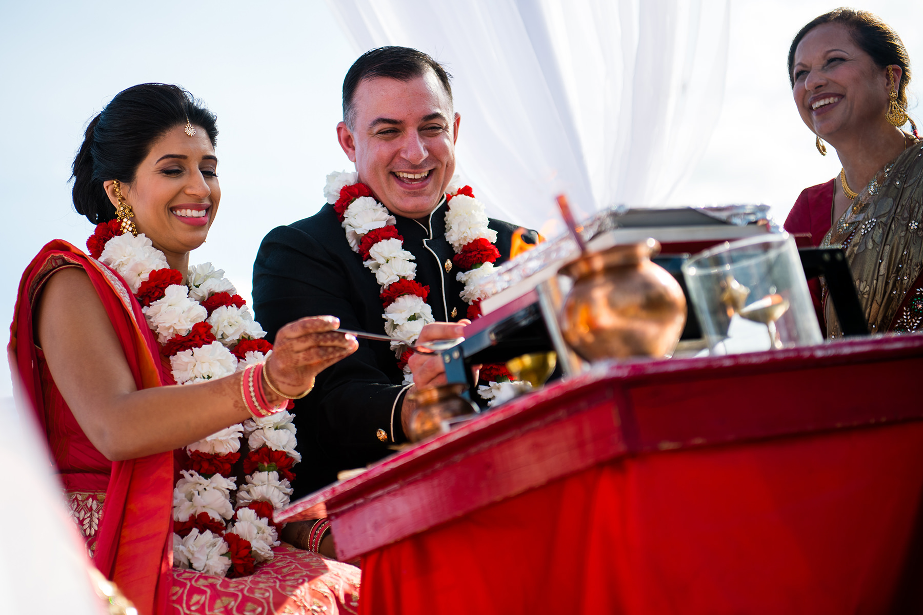 bride and groom add water to fire during hint wedding ceremony