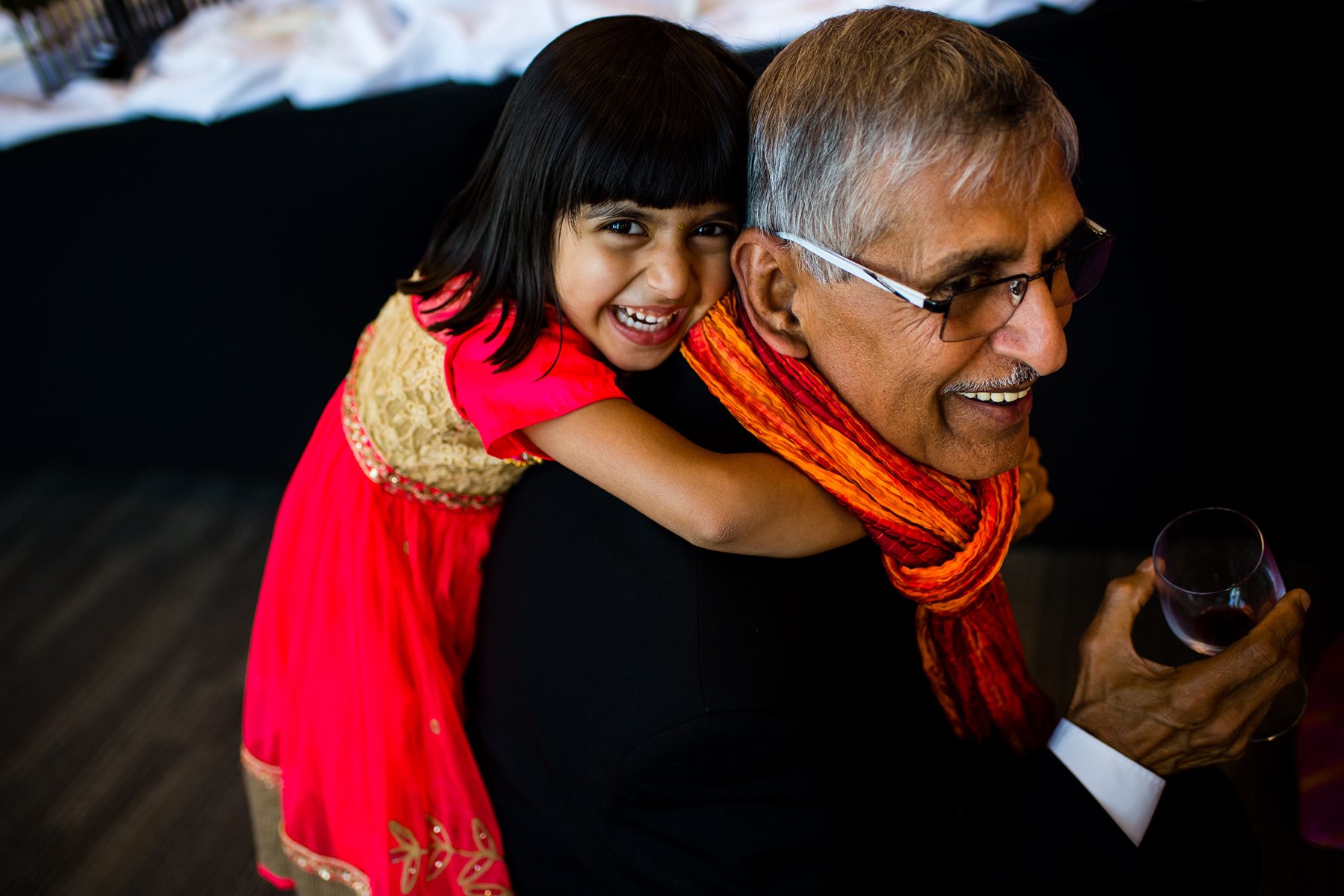 kid and grandparents playing at wedding