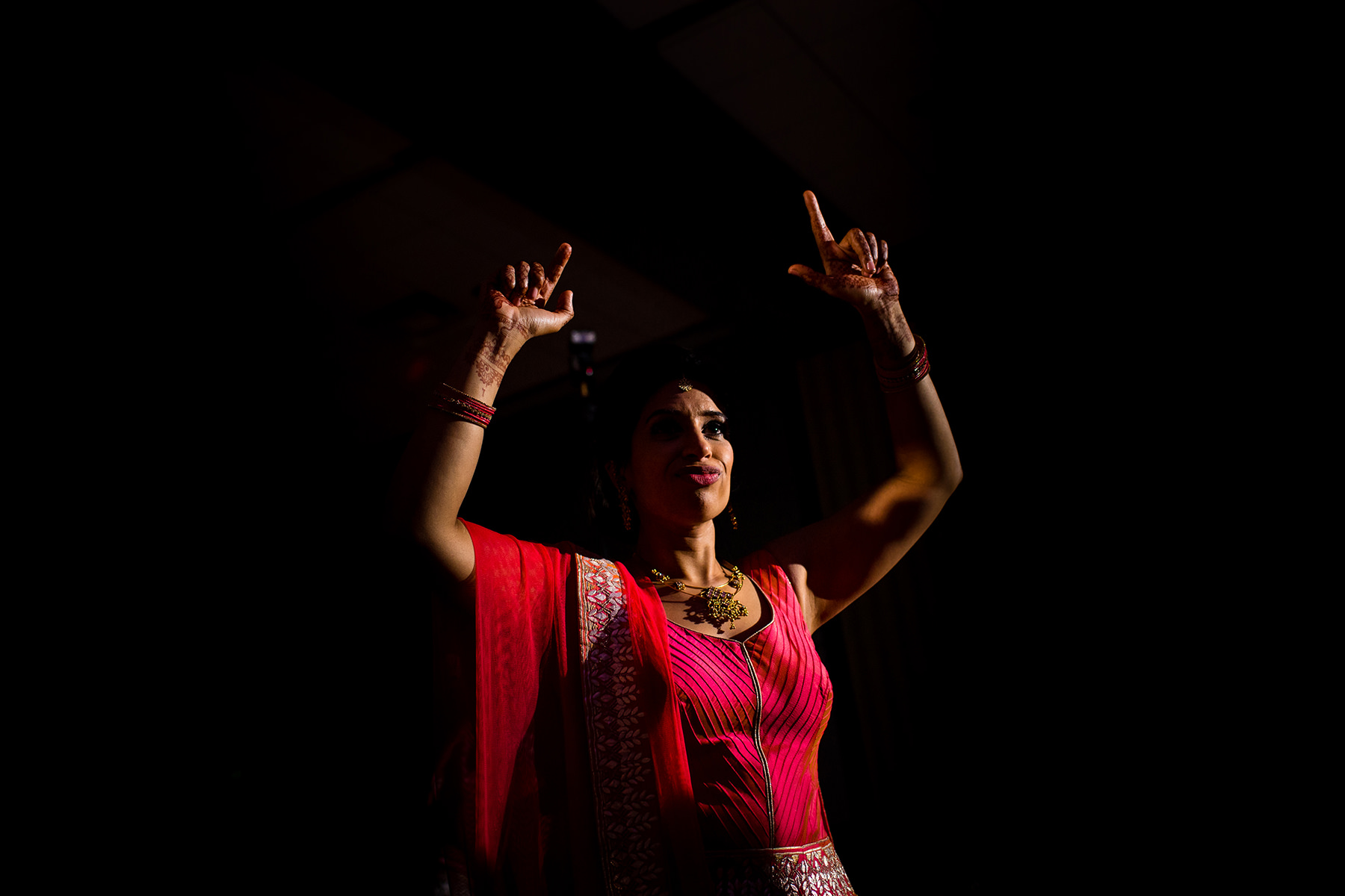 bride dancing in wedding sari